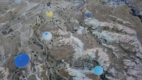 Balloons Fly Over Cappadocia Landscape From Above