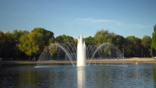 A Fountain in a Park in the Middle of a Lake Autumn View of the Fountain
