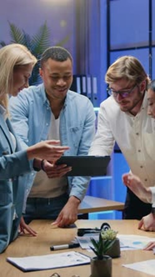 Team Collaborate on Tablet at Modern Workplace