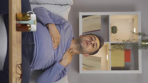 Man Experiencing Chest Discomfort at Home