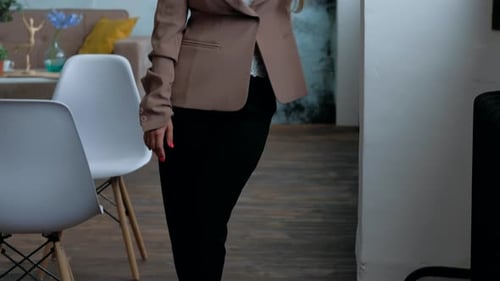 Stylish Woman Poses in Modern Home Setting