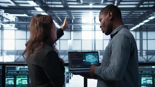 IT Expert Coding on Notebook in Server Room Using Artificial Intelligence