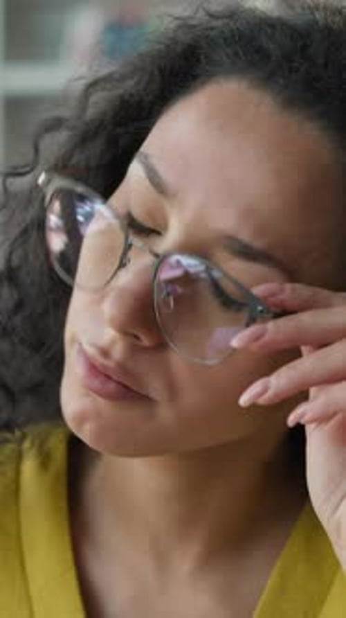 Tired Arabian Latino Woman in Glasses Rubbing Eyes in Library Female Girl Student Exhausted
