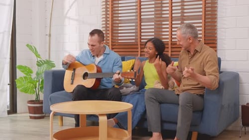 Family Plays Guitar and Sings Together at Home