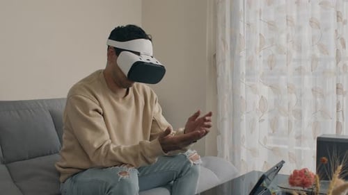 Man Using Virtual Reality Headset at Home