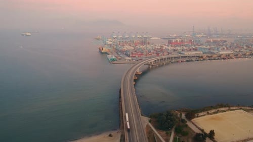 Aerial view moving foward of Algeciras port, close to the container terminal and the bridge that con