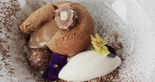 Prepared and decorated dessert in kitchen, slow motion