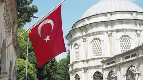 Turkish Flag Waving in front of Landmark Building