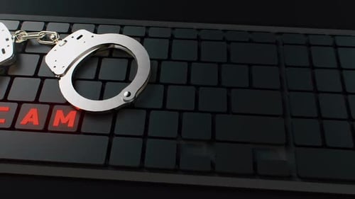 Handcuffs On Keyboard With SCAM Text On Keys