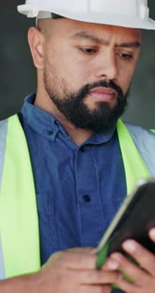 Tablet, man and construction worker on site with email for building, renovation or repairs