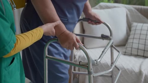 Woman Gets Help with Walker at Home