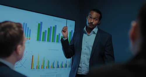 Business Expert Presenting Sales Chart in Office Meeting Portrait of Black Man Prores