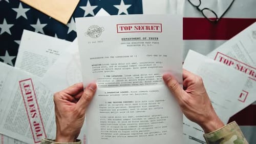 Man Reads Top Secret Document Over Flag