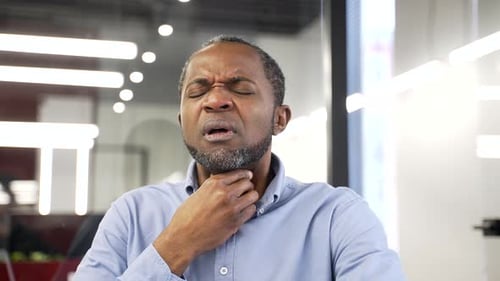Man With Sore Throat in Office