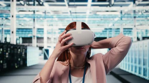 Putting VR Goggles on Hardware and Female Technician in Server Room