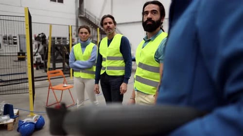 Factory Workers Meeting in Modern Industrial Workplace