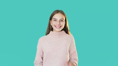 Young Girl Smiling and Clapping with Excitement