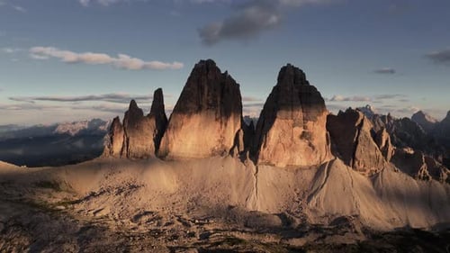 Golden Hour Drone Pullback from Tre Cime di Lavaredo Peaks, Dolomites