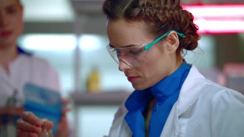 Focused Scientist Working in a Modern Laboratory