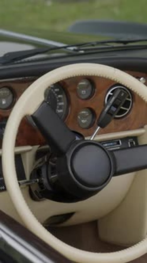 Classic Car Steering Wheel and Dashboard Close Up
