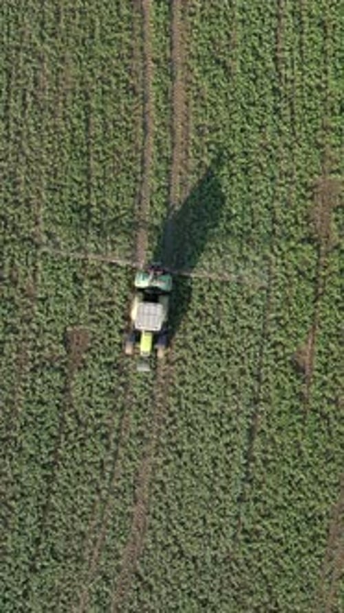Aerial View of Tractor Spraying the Field