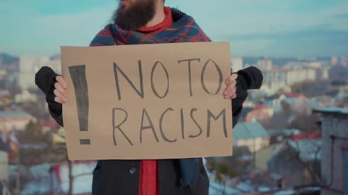 Close Up Hands Man Hold Ecology Poster No to Racism Background Cars City Environment Nature Earth