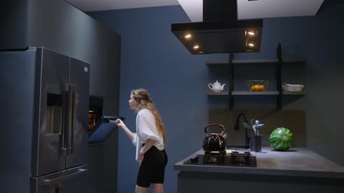 Young Woman Takes a Chocolate Pie Out of the Oven Girl Makes Pastry at Home Female Performs Homemade