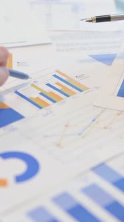 Close up of Creative People Working on Documents, vertical video