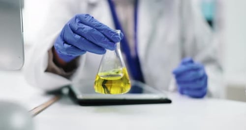 Hands, chemical in beaker and scientist in lab, chemistry and medical research with pharmacy