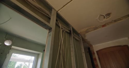 Wide angle tracking shot of a typical german drywall under construction. Low angle shot, looking up.