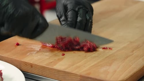 Chef Prepares Beef by Slicing it on Wood