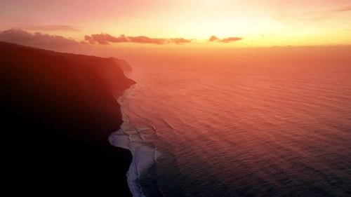 Stunning sunset over coastal cliffs at ocean shore