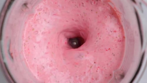 Cooking Strawberry Milkshake in Blender Ripe Fruits Blended with Milk in Blender Slow Motion Top