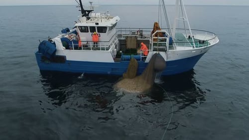 Fishing Boat Pulling Nets in the Open Ocean