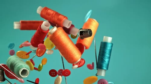 Colorful Sewing Supplies Floating on Turquoise Background