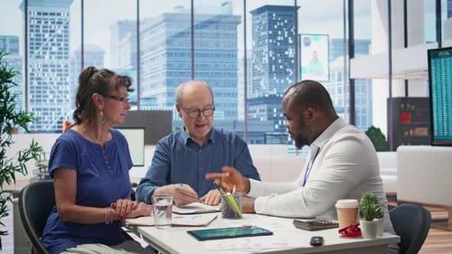 Couple Meeting with Financial Advisor in City Office