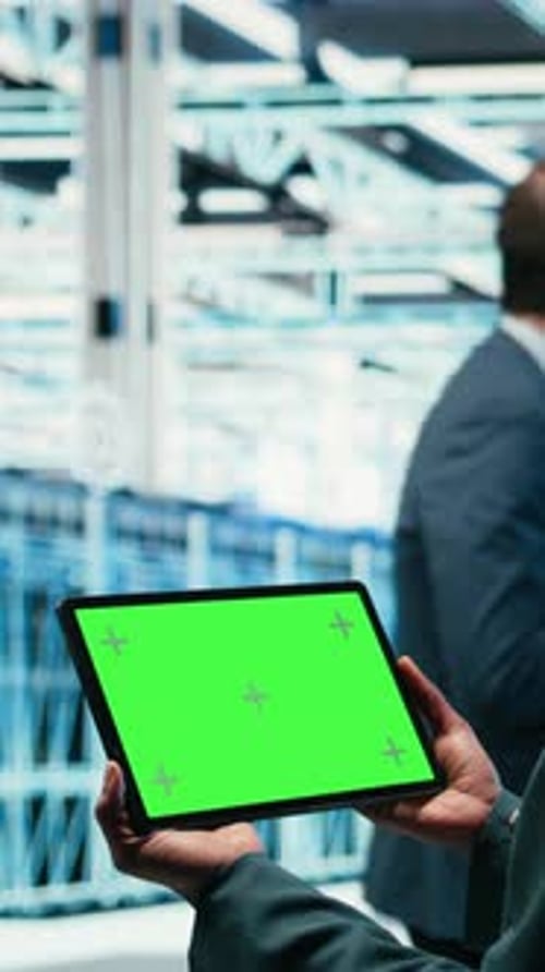 Vertical Video Green Screen Tablet in Data Center and Augmented Reality Used By Developer