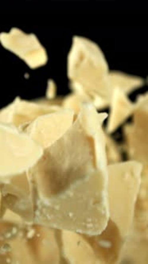 Pieces of White Chocolate Fly Up and Fall Down Filmed on a Highspeed Camera at 1000 Fps
