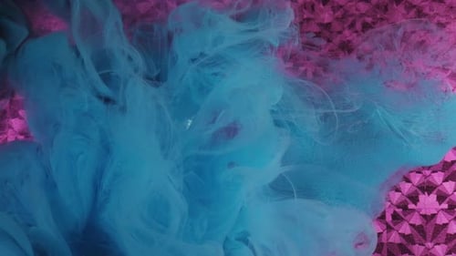 Abstract Blue Ink Swirls on Pink Background