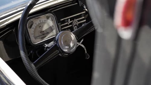 Close-Up Shot of Steering Wheel and Speedometer on Vintage Convertible Car