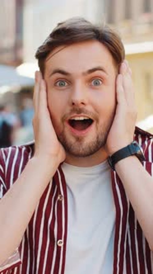 Adult Man Looking Surprised at Camera Shocked By Sudden Win Good Victory News Wow in City Street