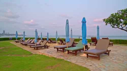 chair pool with sea background - holidays and vacation concept