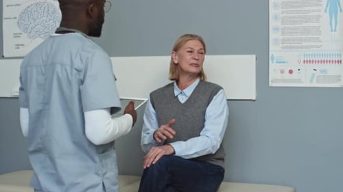 Doctor Consulting with Patient in Medical Office