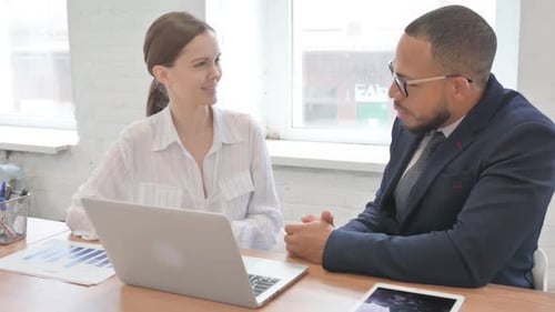 Businessman Talking with Businessman in Office