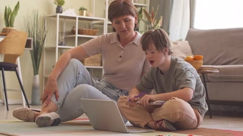 Adult Helping Teen with Homework at Home