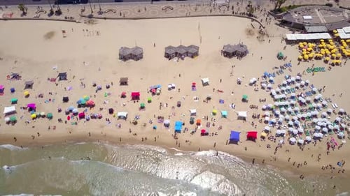 Mediterranean beach during summer with people in the water