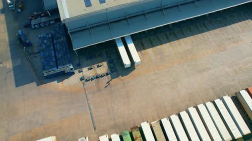 Many of Semi-trailer trucks stand at the distribution center