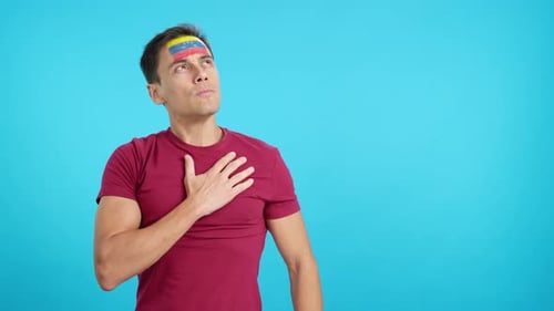 Man Listening to the Venezuela National Anthem with Solemnity