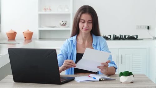 Woman Working Remotely From Home at Desk