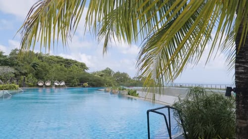 Infinity Pool On Windy Day At Renaissance Bali Uluwatu Resort And Spa In Indonesia. long static shot